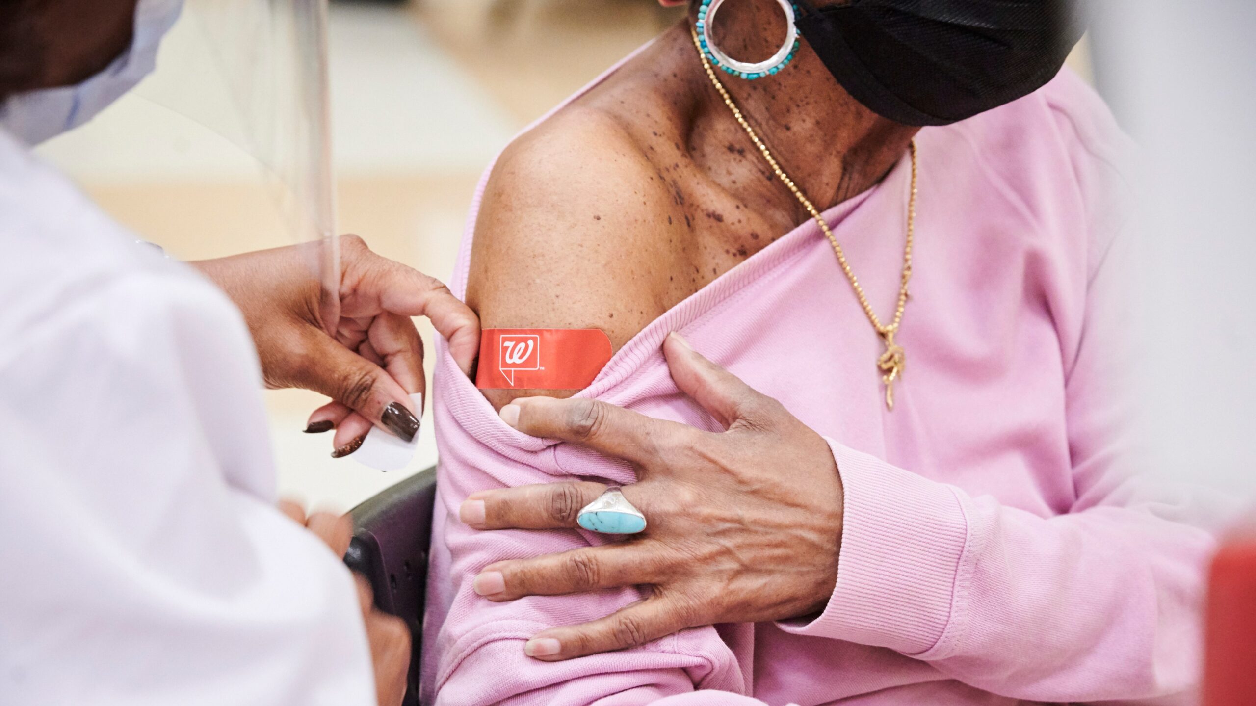 Woman getting COVID-19 vaccine