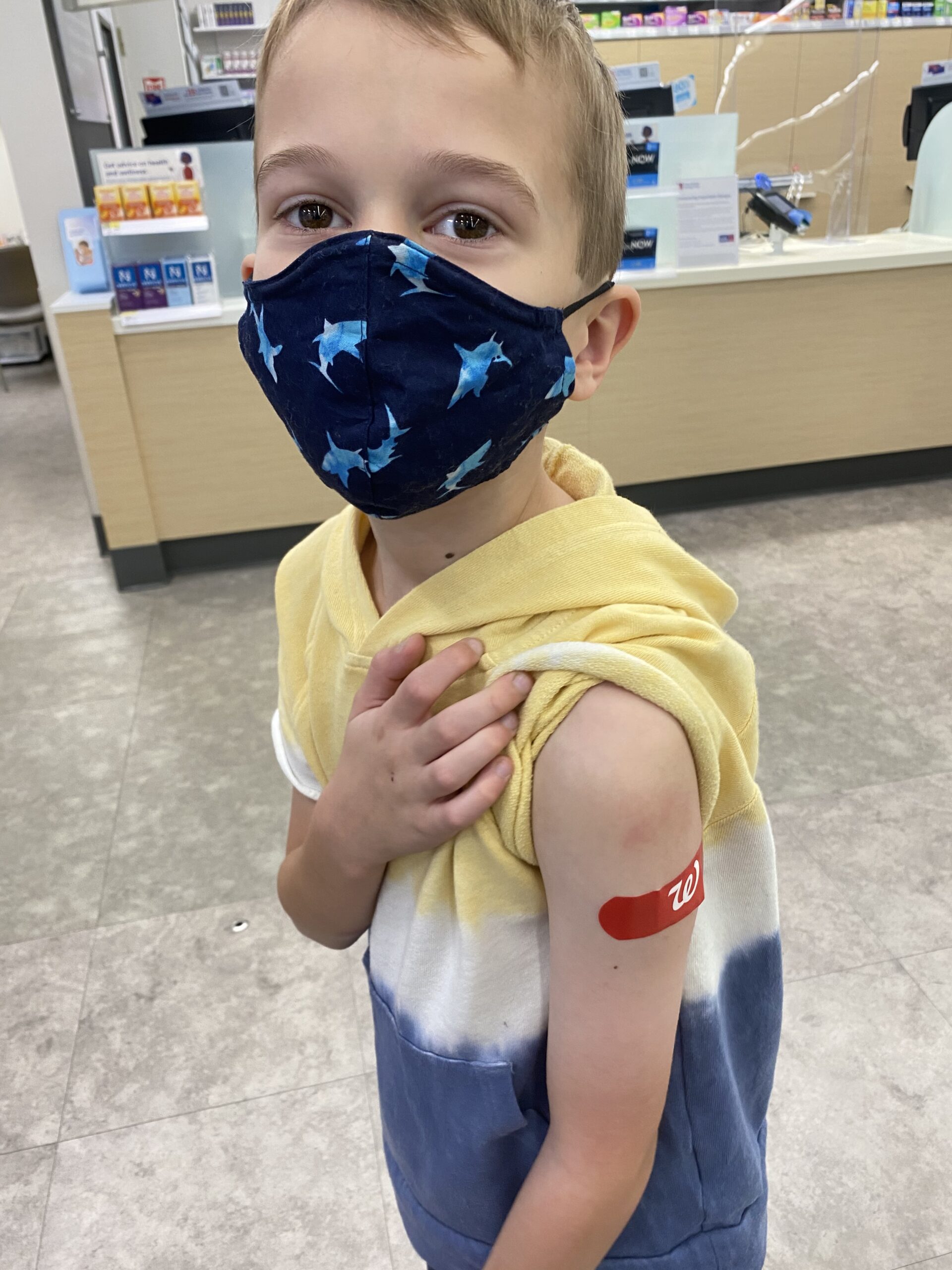 A boy age 5-11 with mask after vaccine