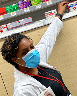 Joynell reaching for the shelf