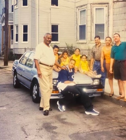 arthur and family resting on car in dominican republic